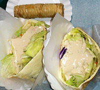 Falafel sandwiches. Word on the street is that if you get the 2 regulars, its bigger than the large. Platter looked FAB!